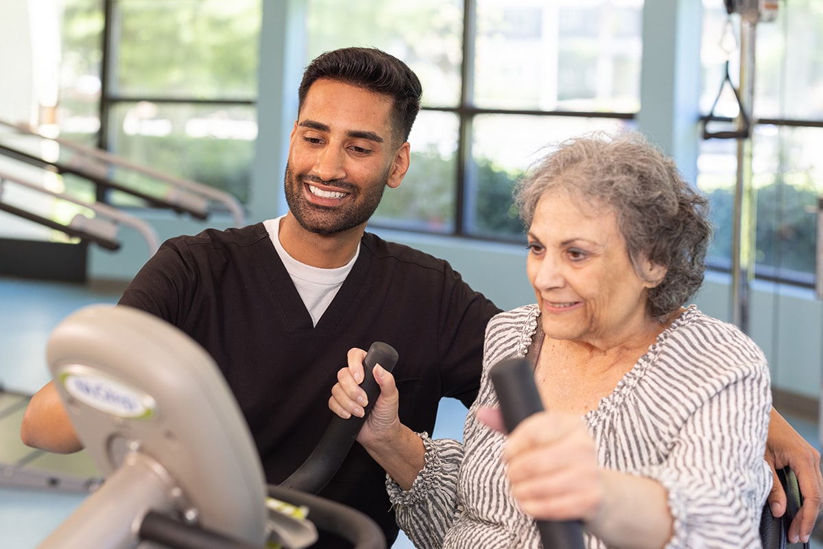 A physical therapist working with a woman Sunnyvale Gardens