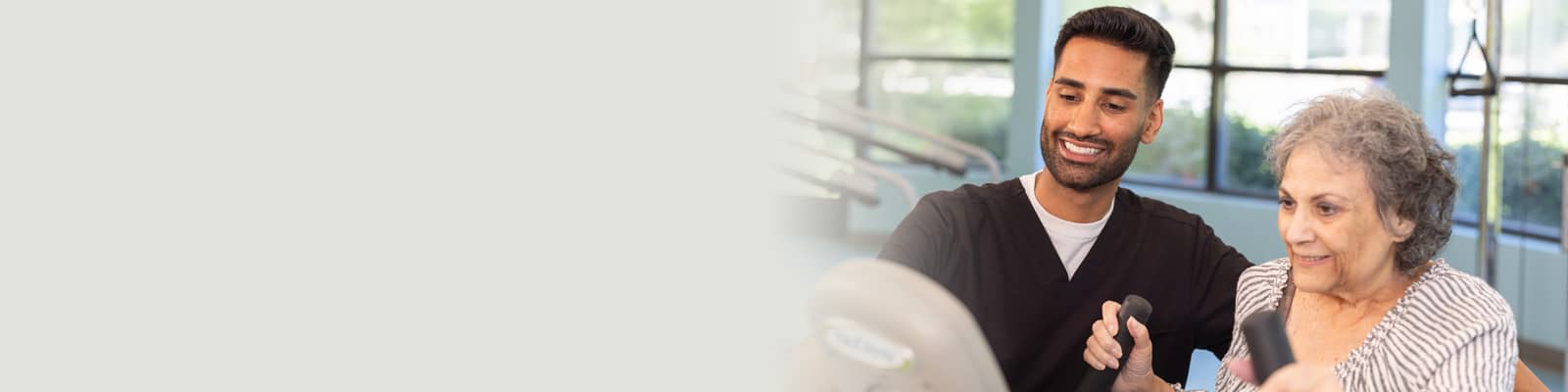 A physical therapist working with an elderly woman at Sunnyvale Gardens